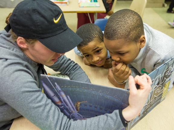 Teacher reading to two children